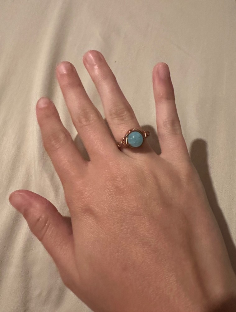 set of three rings, 2 gemstone, 1 wire, unknown specifics