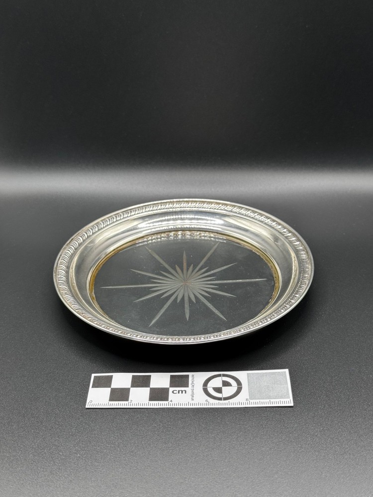 Sterling coaster with cut glass insert.