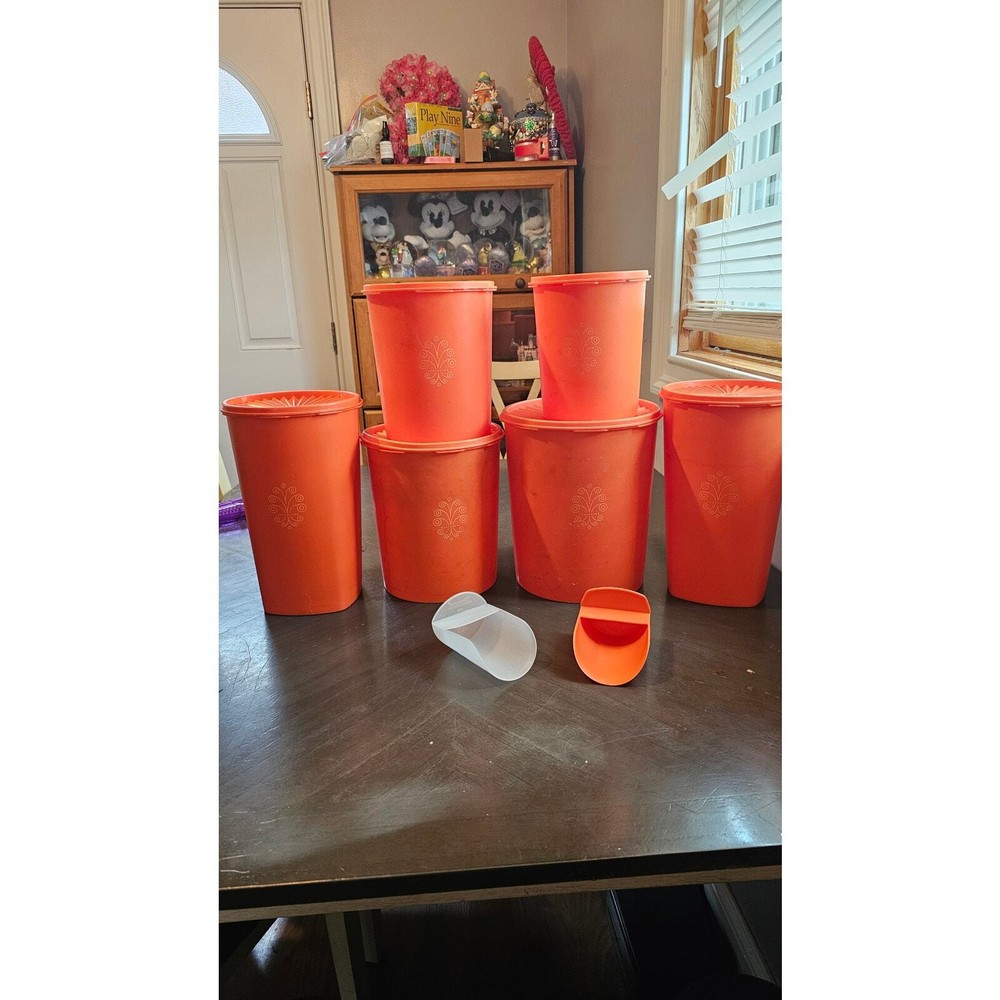 14 piece vintage orange Tupperware canisters- 6 complete and 2 scoops