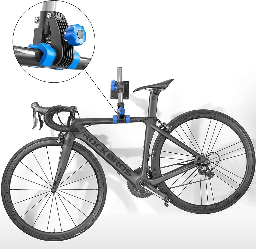 Wall-mounted adjustable bicycle repair stand.