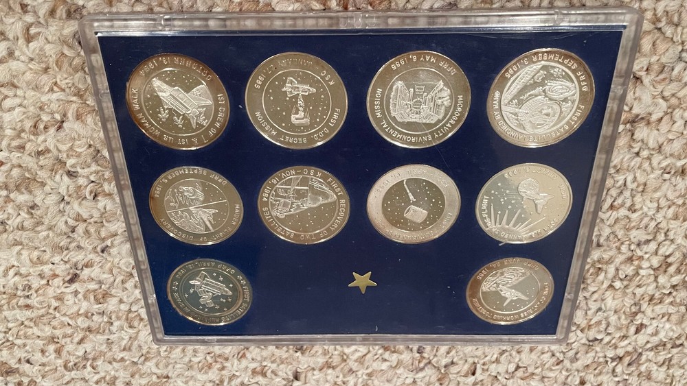 (10) Shuttle Shuttle Flights, silver medals in case, Discovery and Challenger