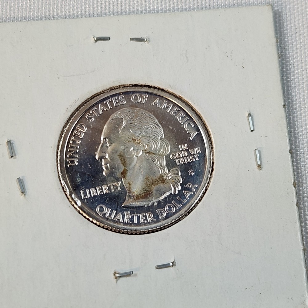 Six Uncirculated State Quarters. See Description