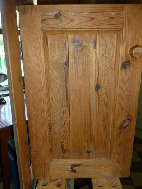 Pine cupboard door in frame. Antique old reclaim, corner.