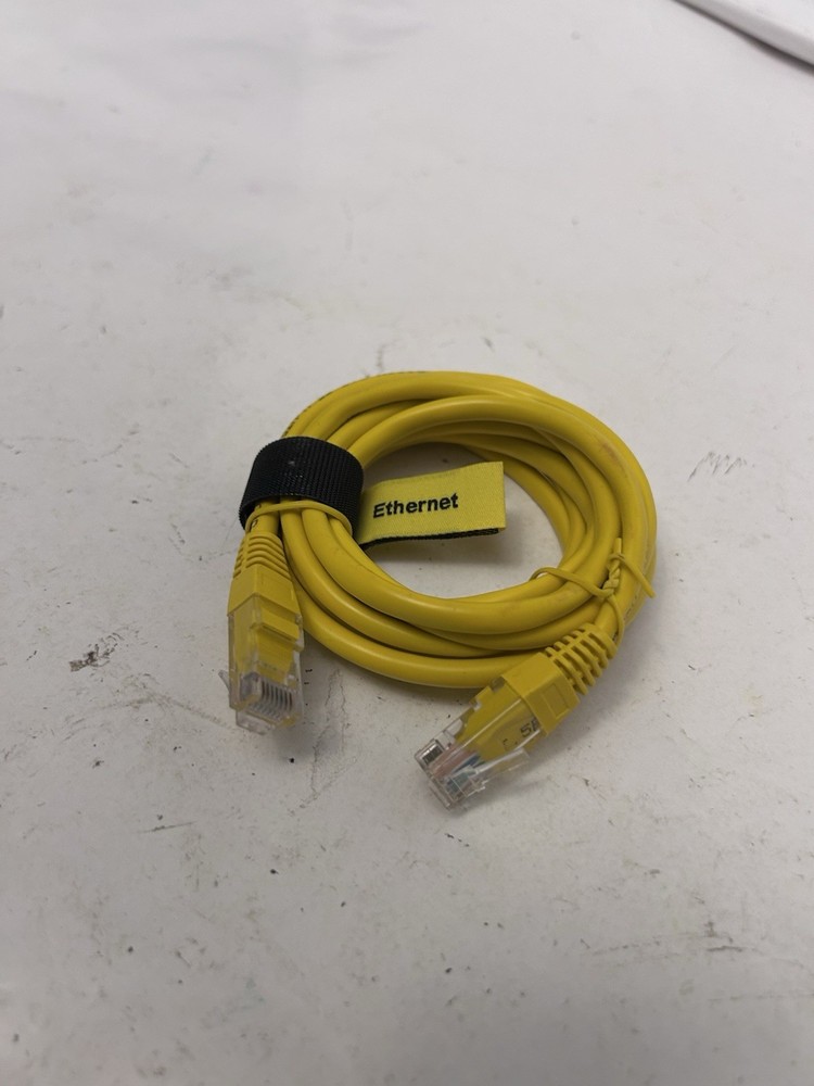 yellow comcast ethernet cord wrapped