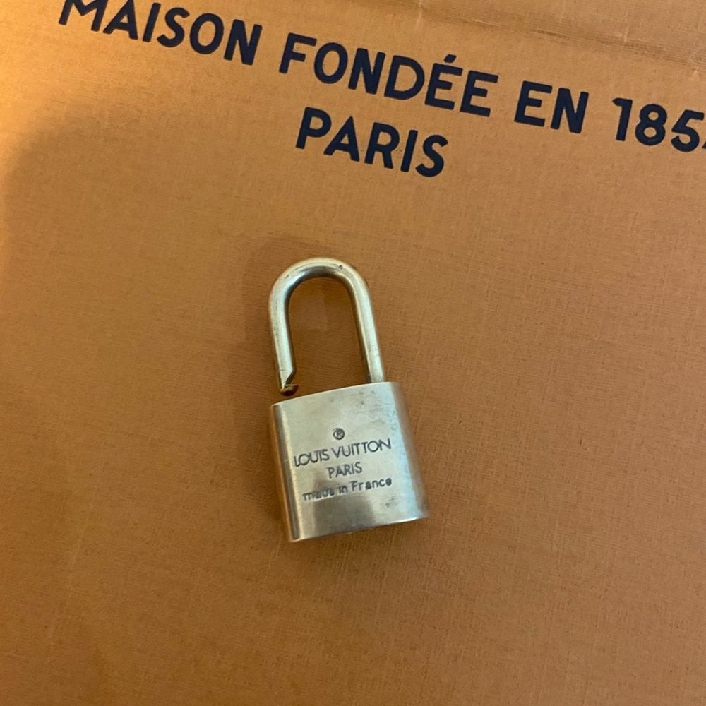 - Authentic Louis Vuitton lock