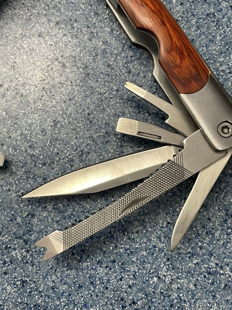 Elk Ridge-Multi Tool With Assorted Tools -pliers -knife-sockets- Bottle Opener