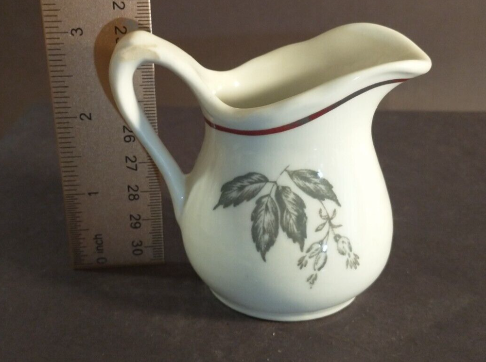 McNicol small creamer with glaze damage on handle