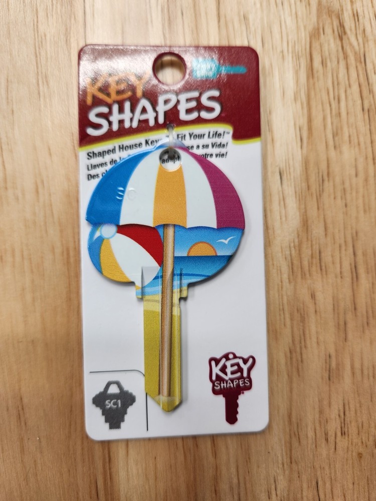 BEACH WITH UMBRELLA SHAPED SCHLAGE SC1 KEYBLANK - READ DETAILS BELOW