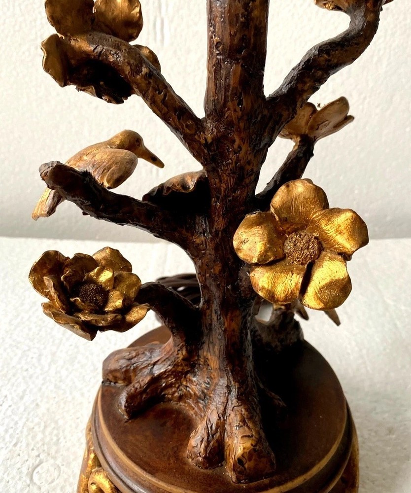 Antique floral and bird table lamp featuring a rustic tree-branch stem