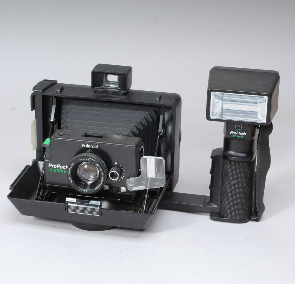 POLAROID PRO-PACK IN THE BOX W CAMERA FLASH STRAP & MANUALS FLASH BAD