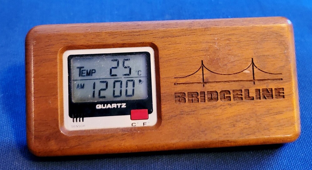 Older Souvenir Wood Look LCD Clock "Bridgeline"