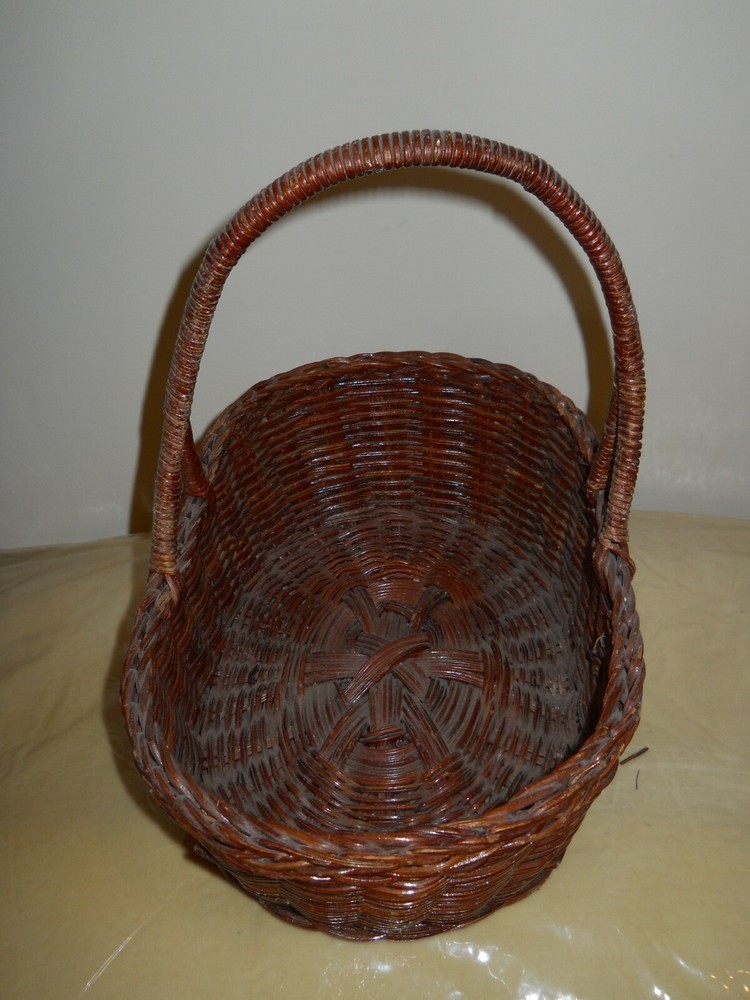 * Oval Brown Wicker basket ~ 12" x 8" x 4" .