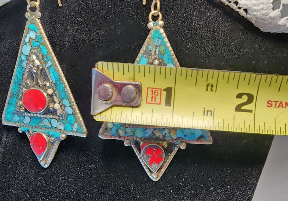 Triangle-shaped dangle earrings featuring mosaic-style turquoise