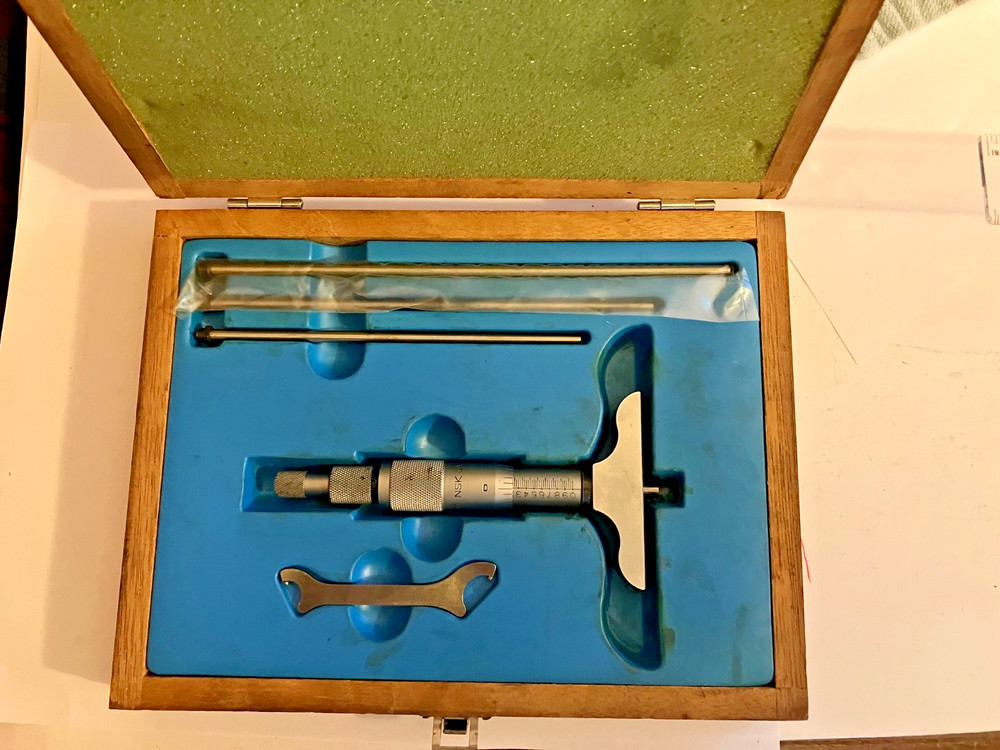 NSK Depth Micrometer set. (0-4") . In nice condition. Case insert needs cleaned