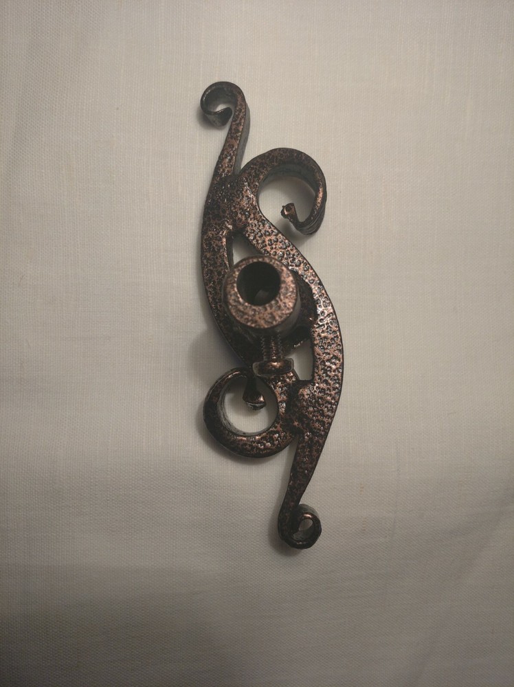 Wrought iron handle for the fireplace