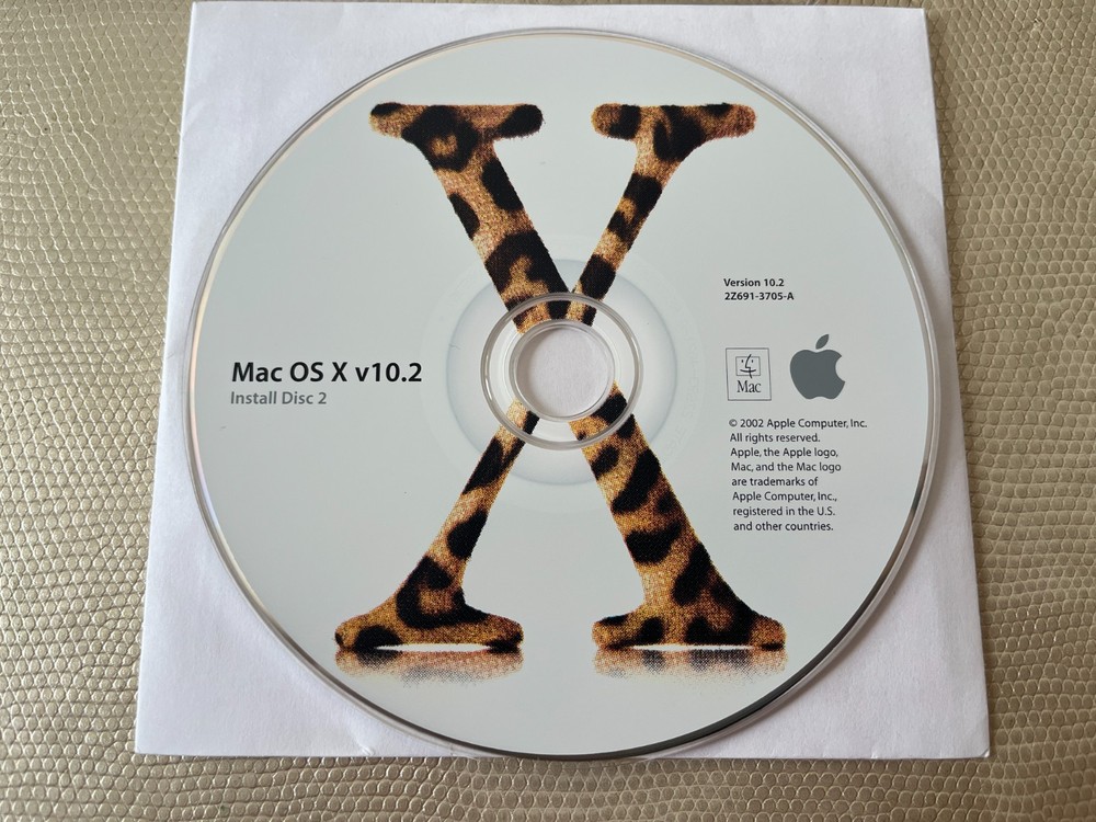 Mac OS X 10.2 Jaguar install discs + developer tools disc and Mac OS X manual