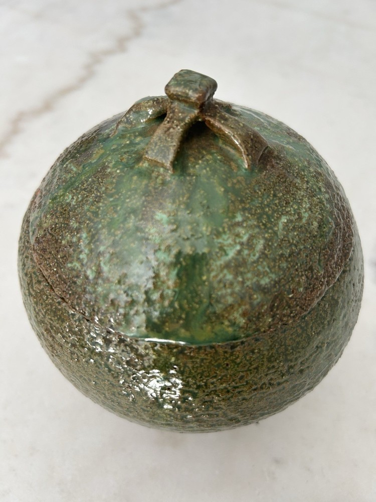 Stoneware pottery lidded jar with green salt glaze