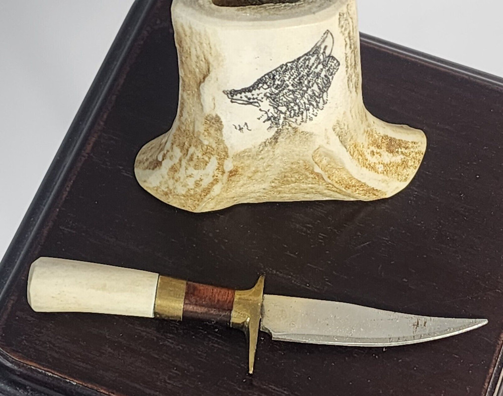 Small Knife In Bone looking Holder With Wolf On