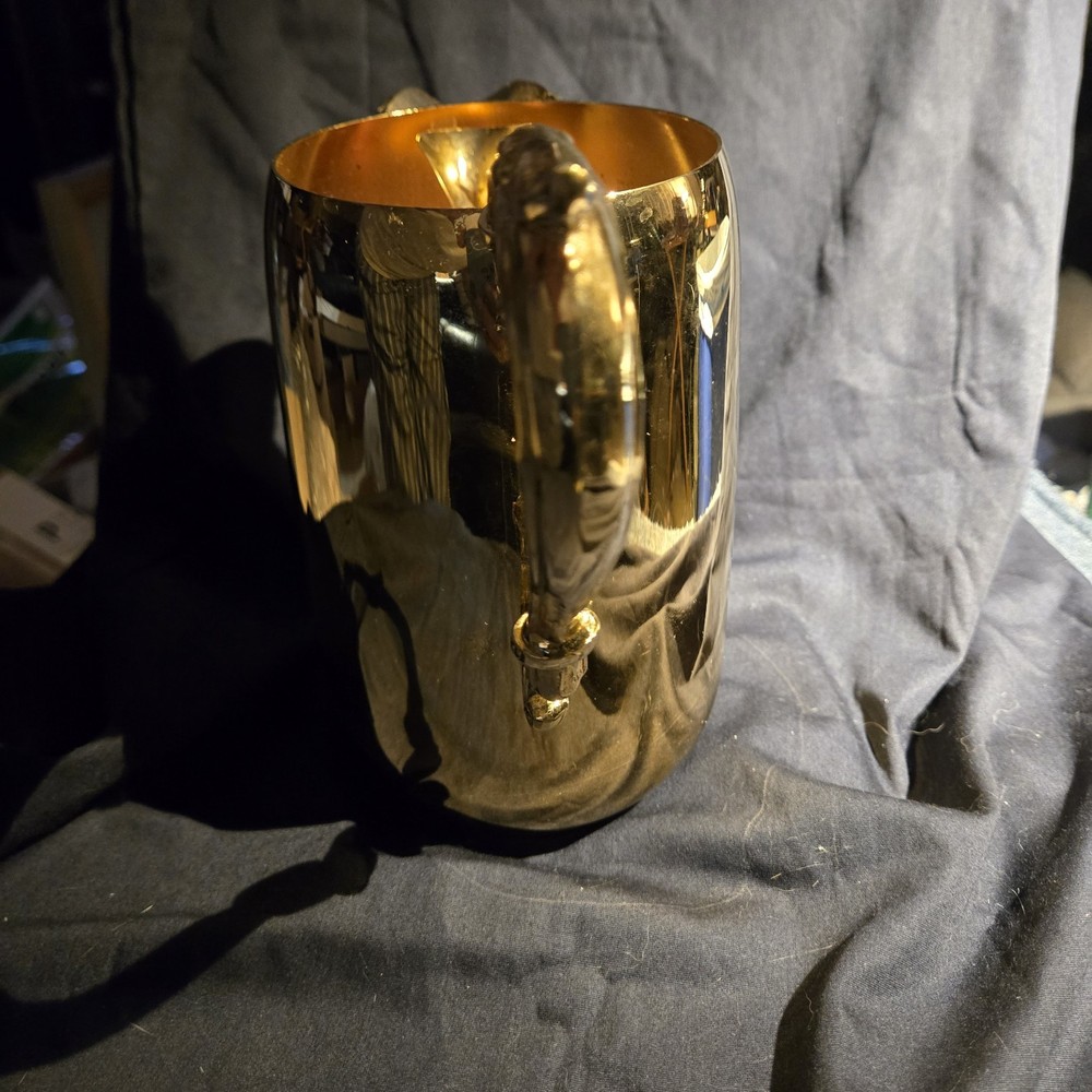 Sheridan silver-plated pitcher with ornate handle and spout