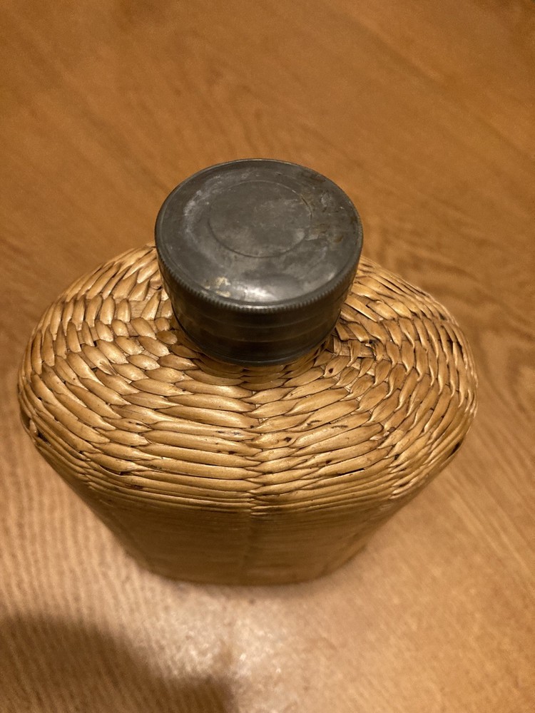 Vintage glass / wicker covered bottle/flask in nice condition.
