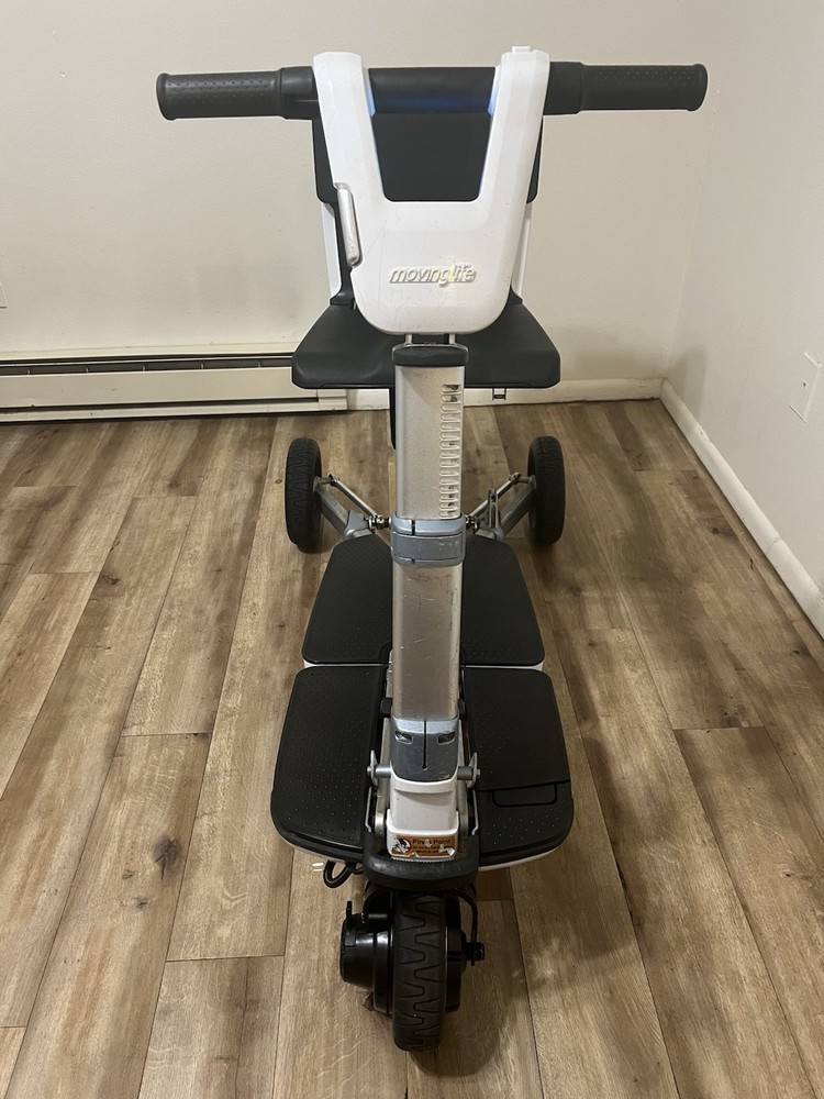 Atto folding scooter color black and white three wheels solid tires