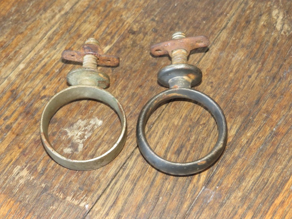 Two Antique Primitive Metal Ring Band Pipe Brackets
