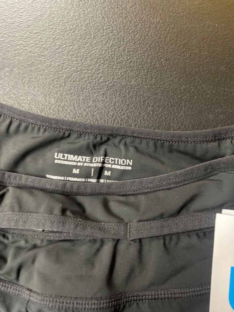 Ultmate Direction Athlete running shorts with water bottles