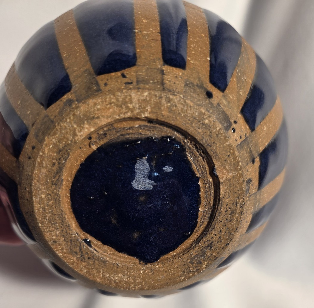 Pottery pitcher 2 toned with handle.