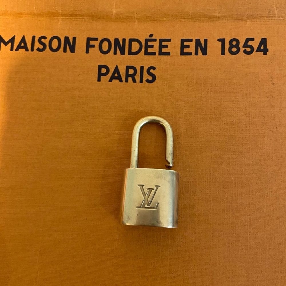 - Authentic Louis Vuitton lock