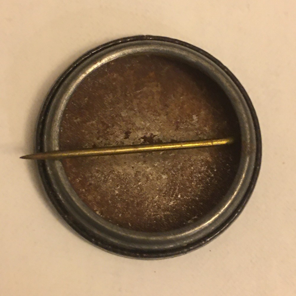 XIOM Omega pinback