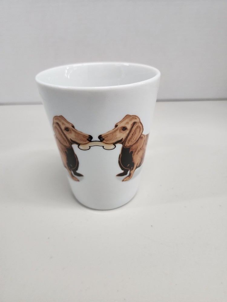 white ceramic mug featuring a brown dachshund design with a distinctive dog