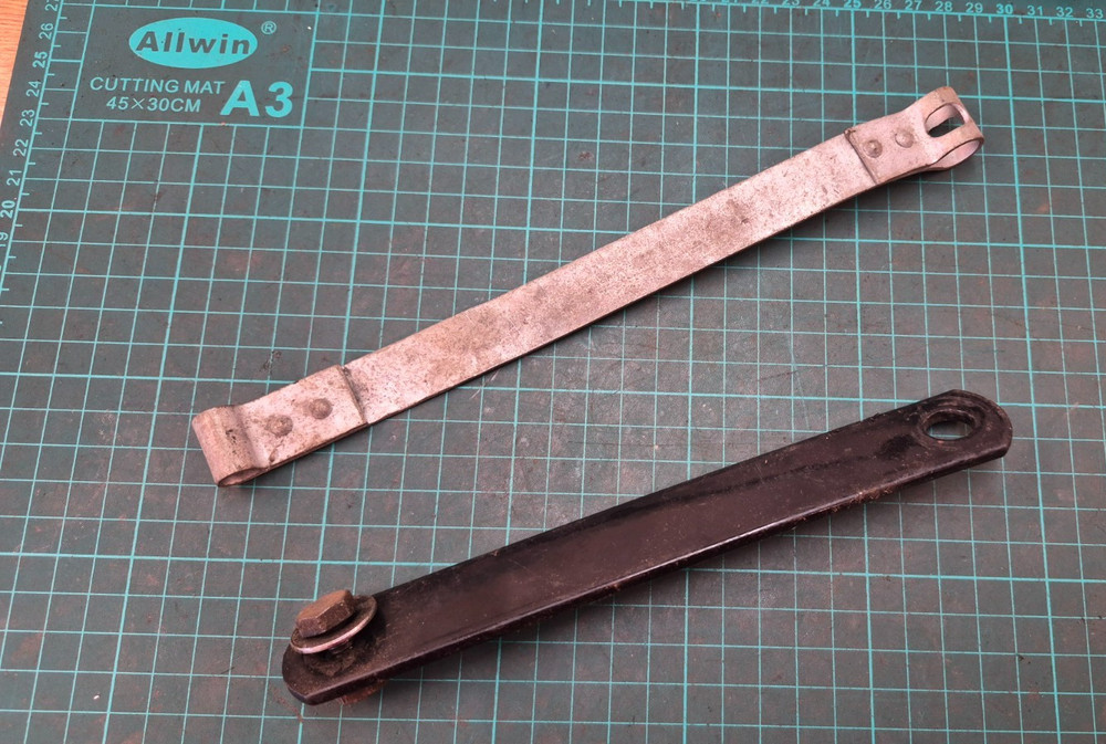 BSA battery Strap and piece of tin ware