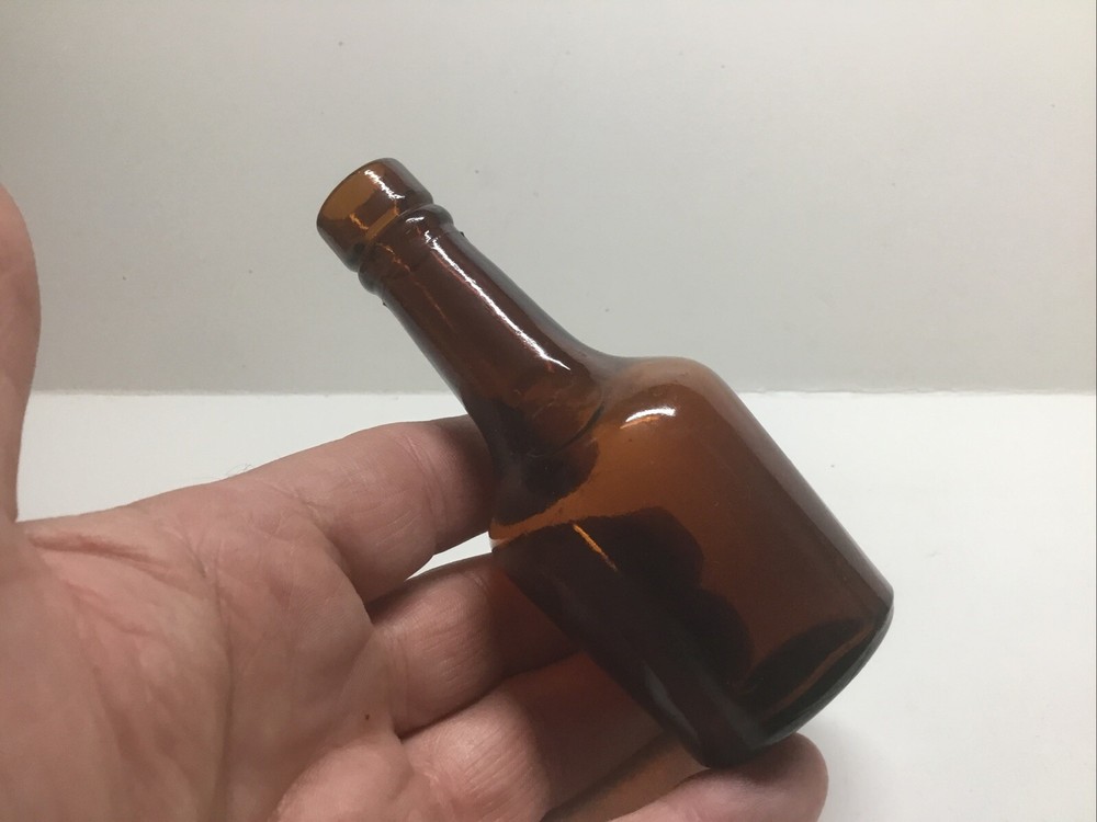 Small Squatty Antique Amber Sample Liquor Bottle.