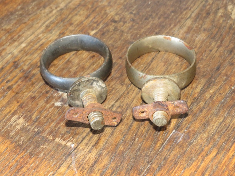 Two Antique Primitive Metal Ring Band Pipe Brackets