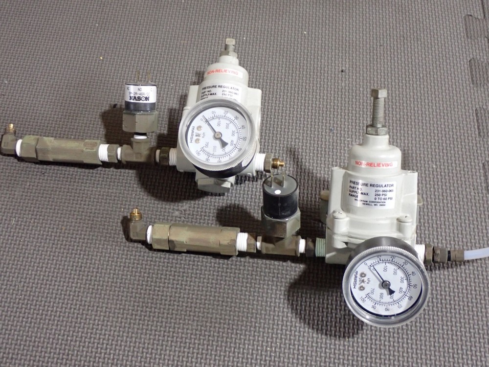 Gas flow regulators and desiccant