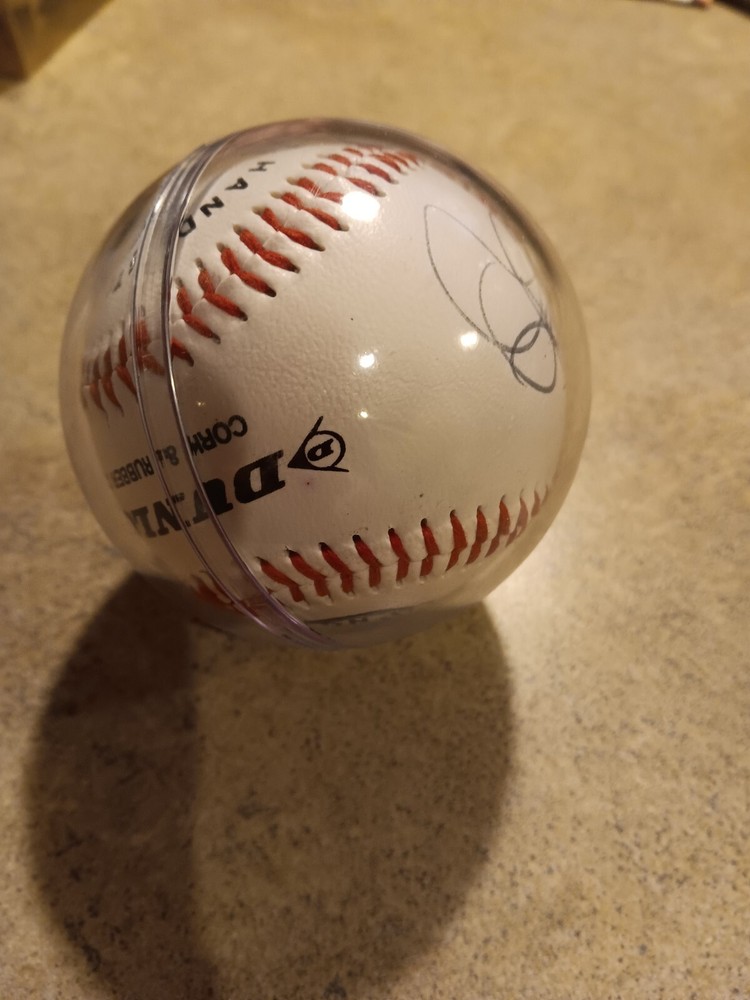 Baseball in case facsimile or real signatures in case