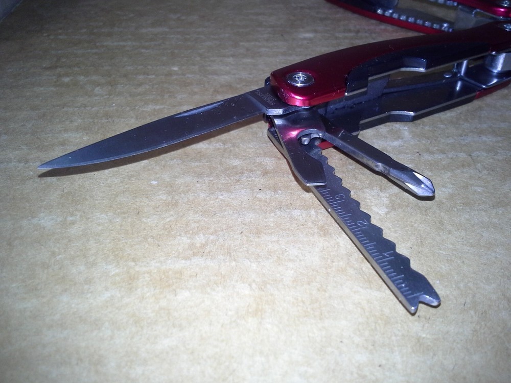 Switzerland Red Multitool Folding Pocket Pliers. VGC