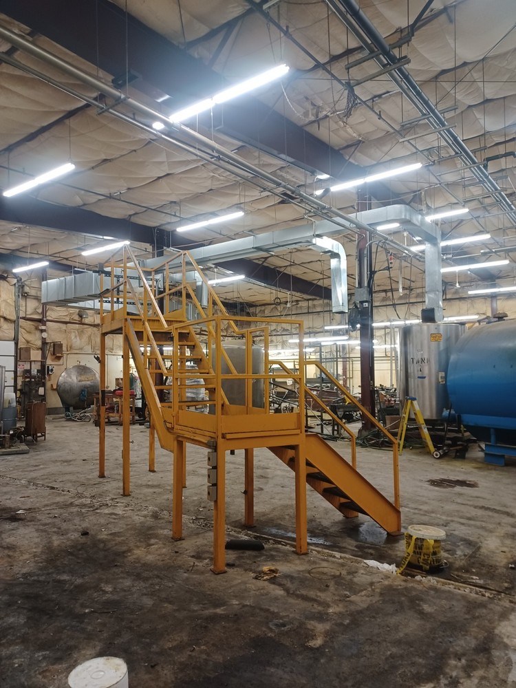 STEEL CONSTRUCTED MEZZANINE | COLOR: YELLOW | MULTI-LEVEL | MODULAR CONSTRUCTION