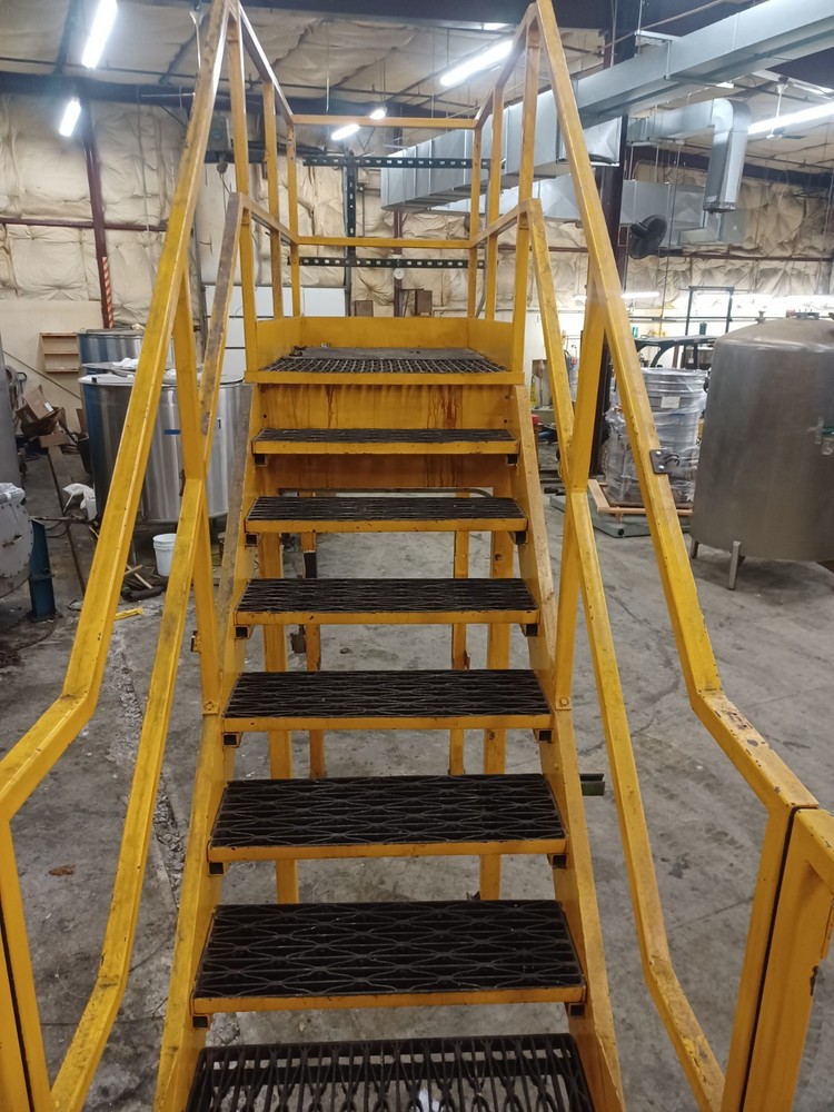 STEEL CONSTRUCTED MEZZANINE | COLOR: YELLOW | MULTI-LEVEL | MODULAR CONSTRUCTION