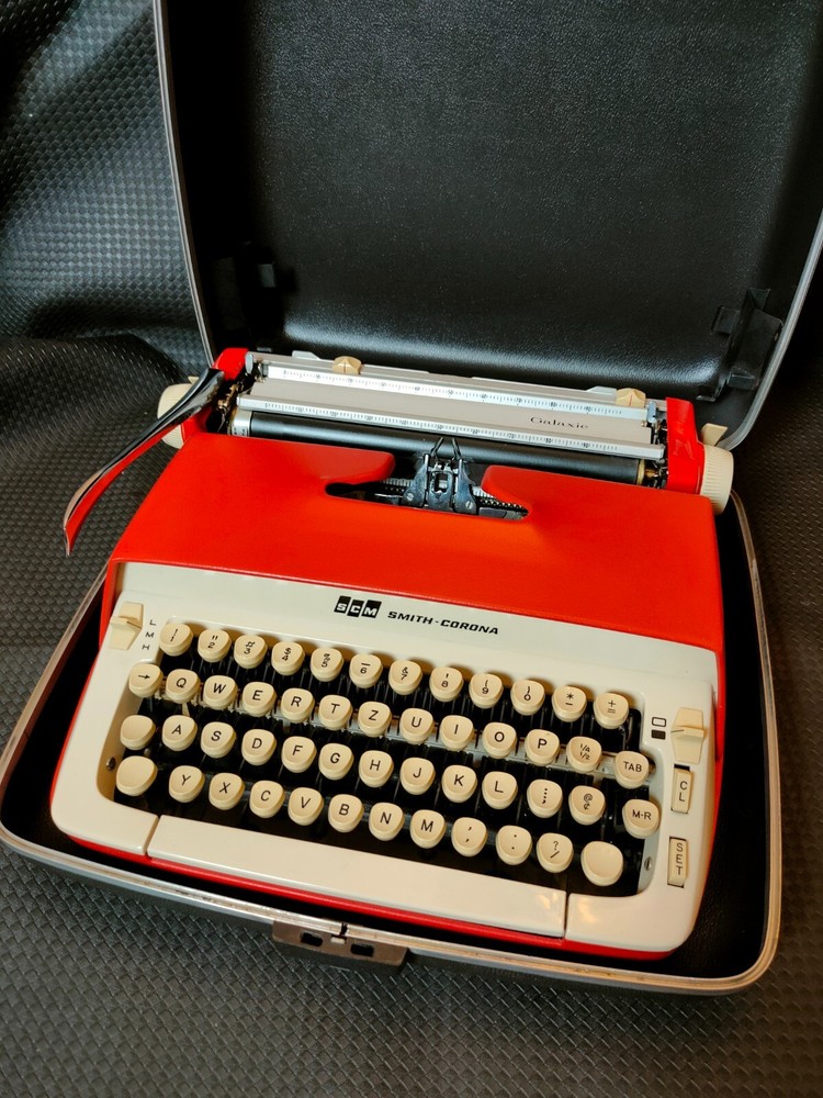 red, portable Smith Corona Galaxie typewriter with Cursive / Handwritten Script