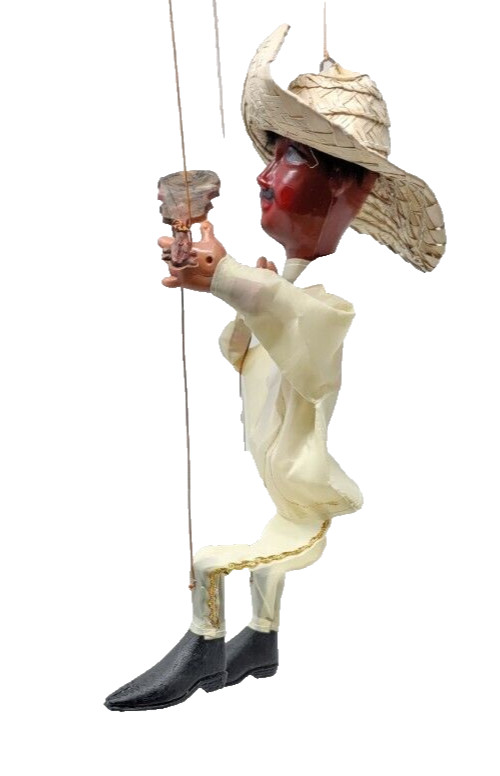 traditional mexican marionette puppet with plastic guns