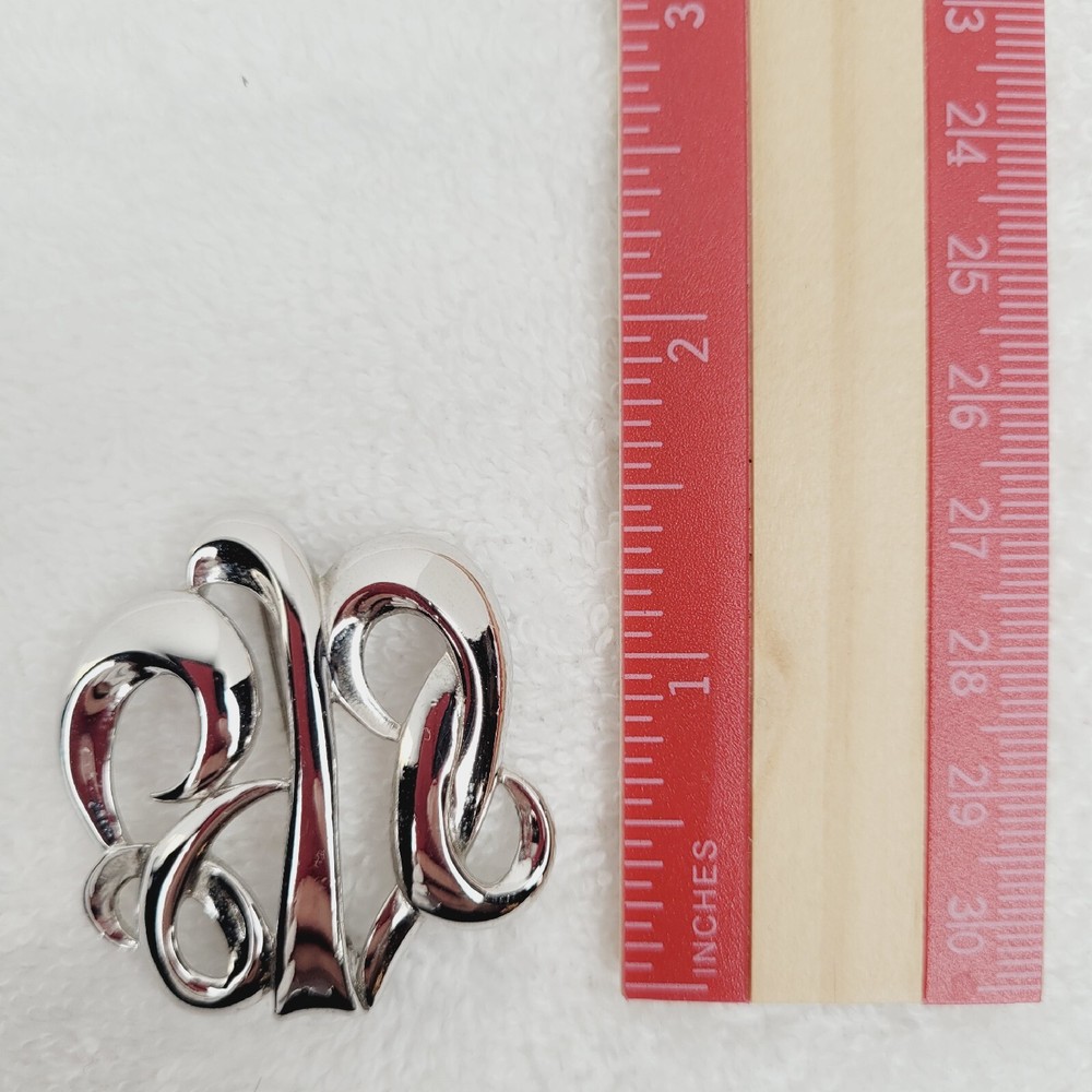 Vintage MONET Silvertone Swirl Brooch Simple Elegant Signed