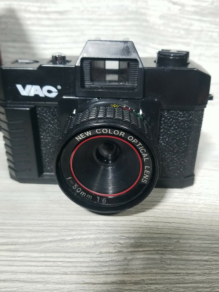 Vac 35MM Camera with Handstrap, Carrying Case, and Lens Cap