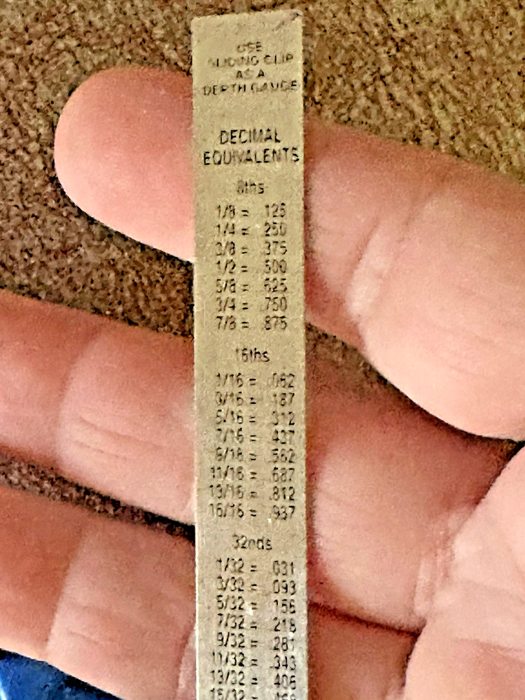 Garlock Slide Ruler and a Seam Ripper