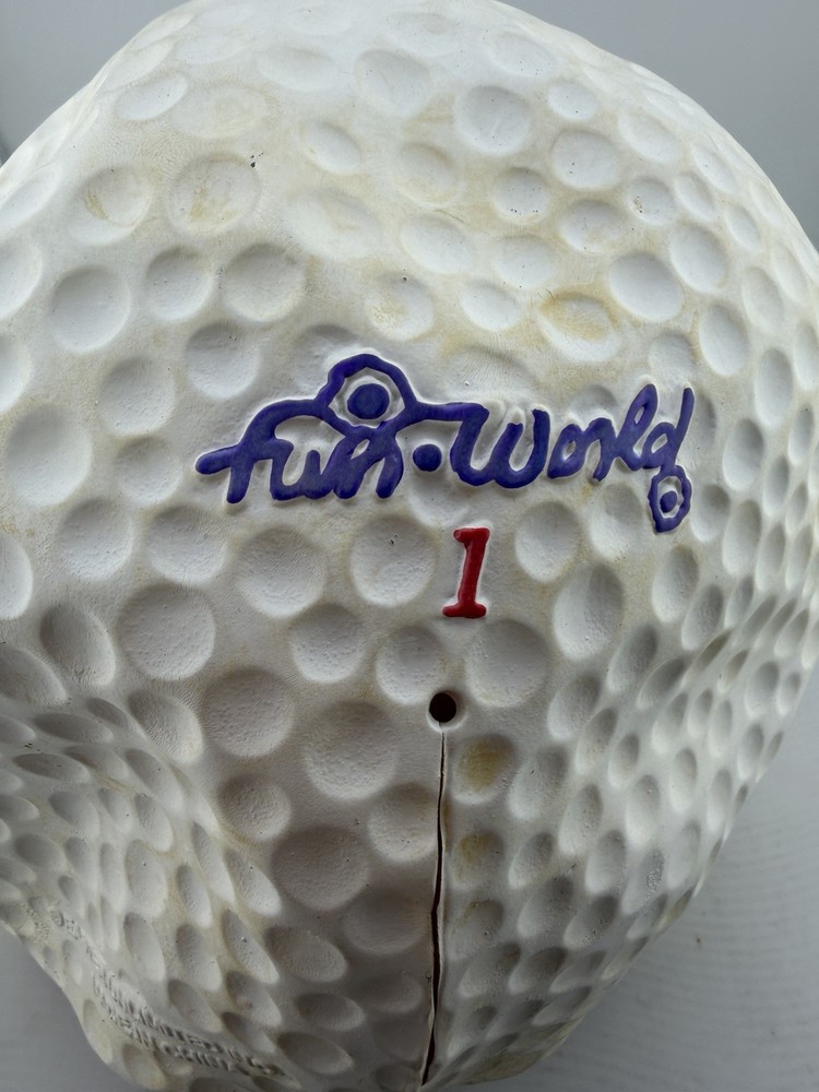 “ Mad Grinning Golf Ball” Produced By Fun World. Textured Surface