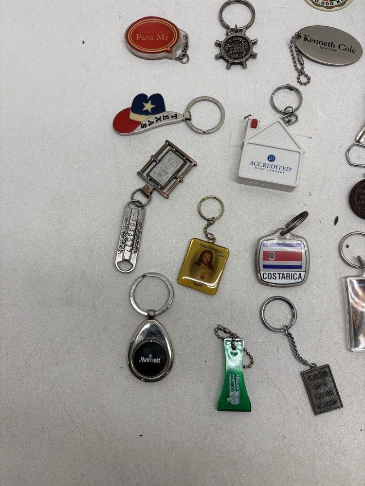 32 Vintage Key Chains And a John Deere Tin Box