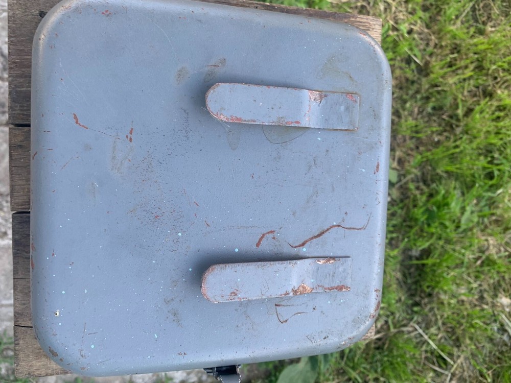 Old Soviet first aid kit with military equipment.