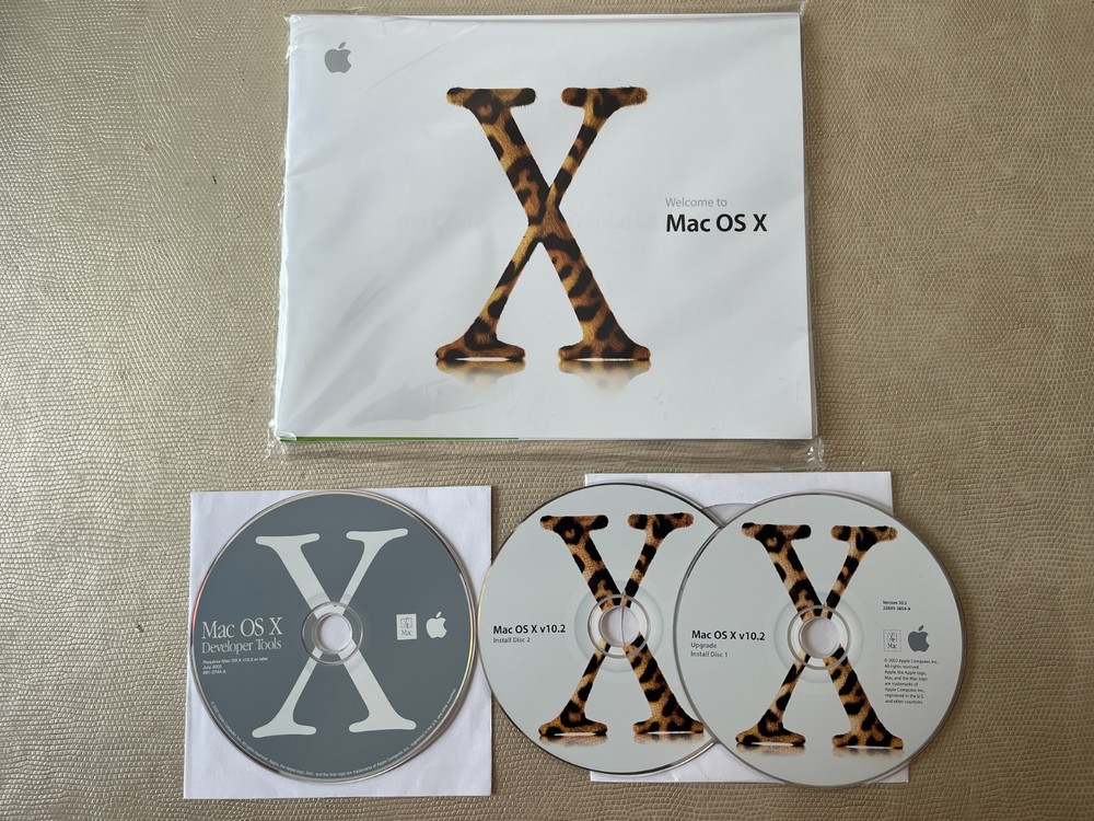 Mac OS X 10.2 Jaguar install discs + developer tools disc and Mac OS X manual