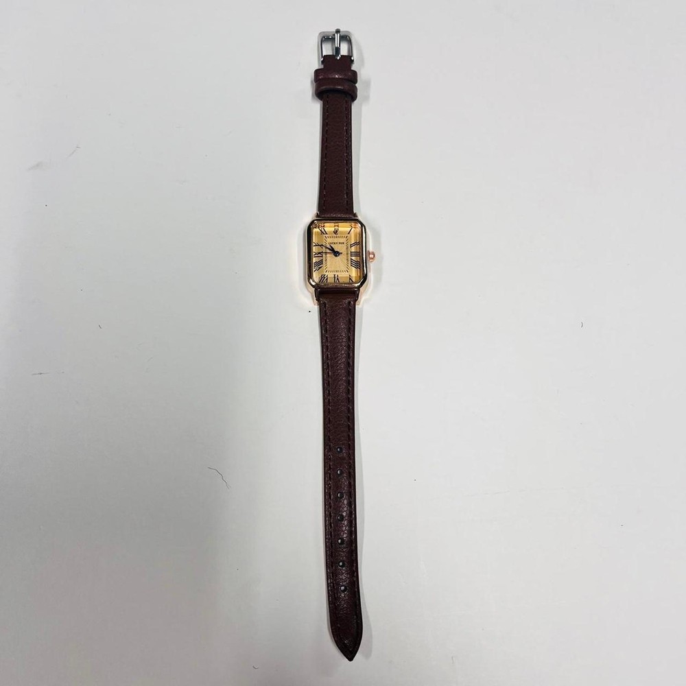 2000s vintage style rectangular gold luxury watch with leather band