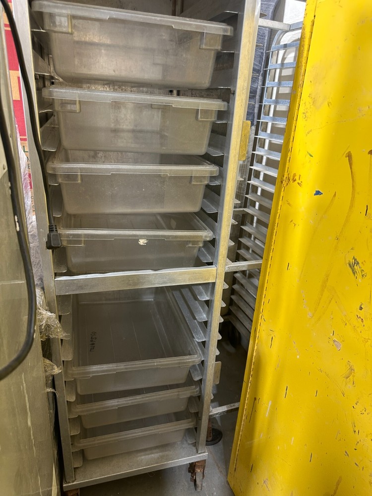 Enclosed rolling sheet pan rack on wheels